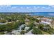 Aerial view of the property showcasing the home's location, nestled amongst lush greenery and trees at 1311 Beach Ne Dr, St Petersburg, FL 33701