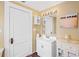A charming bathroom featuring a vanity with storage, and a large mirror at 1311 Beach Ne Dr, St Petersburg, FL 33701