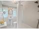 Bright bathroom with white subway tile, mosaic floors, and vintage-style fixtures at 1311 Beach Ne Dr, St Petersburg, FL 33701