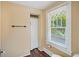 A simple bathroom featuring a window, shower with curtain, and dark floors at 1311 Beach Ne Dr, St Petersburg, FL 33701