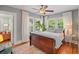 Cozy bedroom with hardwood floors, and large windows allowing natural light at 1311 Beach Ne Dr, St Petersburg, FL 33701
