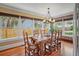 Bright dining room with a large wood table, chairs, and multiple windows bringing in natural light at 1311 Beach Ne Dr, St Petersburg, FL 33701