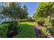 Landscaped front yard with vibrant plants and lush green lawn providing a serene outdoor view at 1311 Beach Ne Dr, St Petersburg, FL 33701