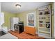 Cozy kitchen features a stainless steel stove and refrigerator, next to light wood flooring at 1311 Beach Ne Dr, St Petersburg, FL 33701