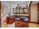 Lovely kitchen featuring custom cabinets, granite counters, a central island and hanging pot rack at 1311 Beach Ne Dr, St Petersburg, FL 33701