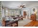 Inviting living room with hardwood floors, a large sectional sofa, and a cozy ambiance at 1311 Beach Ne Dr, St Petersburg, FL 33701