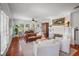 Bright living room featuring hardwood floors, a fireplace, and comfortable seating arrangements at 1311 Beach Ne Dr, St Petersburg, FL 33701