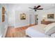 The main bedroom features hardwood floors, a ceiling fan, and is brightly illuminated at 1311 Beach Ne Dr, St Petersburg, FL 33701