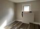 Bedroom featuring a window and wood-look flooring at 1554 Tilley Ave, Clearwater, FL 33756