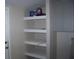View of a pantry with shelves and white cabinets at 1554 Tilley Ave, Clearwater, FL 33756