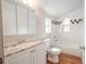 Bright bathroom with marble counter tops and decorative tiled shower at 1800 27Th N Ave, St Petersburg, FL 33713