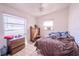 Bedroom with neutral walls, tiled floor, ceiling fan and natural light at 1800 27Th N Ave, St Petersburg, FL 33713