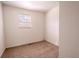 Bright bedroom showcasing a window that lets in natural light and neutral carpeting at 1800 27Th N Ave, St Petersburg, FL 33713