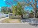 Charming single-story home with light yellow paint and lush landscaping at 1800 27Th N Ave, St Petersburg, FL 33713