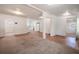 Bright living room with neutral carpet, new paint and a clear view into the kitchen and other rooms at 1800 27Th N Ave, St Petersburg, FL 33713