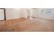 Spacious living room with neutral carpet, new paint and plenty of natural light, adjacent to the kitchen at 1800 27Th N Ave, St Petersburg, FL 33713
