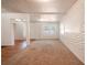 Bright living room with neutral carpet, new paint and a textured wall, offering a versatile living space at 1800 27Th N Ave, St Petersburg, FL 33713