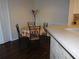 Compact dining space featuring a round table, complemented by a breakfast bar and nearby storage closet at 18106 Peregrines Perch Pl # 5208, Lutz, FL 33558