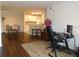Open-concept living space showcasing the dining area and kitchen with a breakfast bar, bathed in natural light at 18106 Peregrines Perch Pl # 5208, Lutz, FL 33558