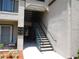 Exterior stairwell for upper units, providing access to residences in a multi-story complex at 18106 Peregrines Perch Pl # 5208, Lutz, FL 33558