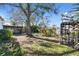 A spacious backyard with a swing set and a screened-in patio to enjoy the view at 223 33Rd N Ave, St Petersburg, FL 33704