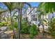 Charming home exterior with tropical landscaping and ample light at 223 33Rd N Ave, St Petersburg, FL 33704