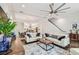 Open-concept living room features hardwood floors, a modern ceiling fan, and stylish decor at 3505 S Macdill Ave # 4, Tampa, FL 33629