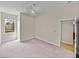 Bedroom featuring neutral walls, ceiling fan and plush carpeting at 3512 Kalebs Forest Trl, Dover, FL 33527