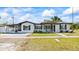 Charming single-story home featuring a well-maintained lawn, and neutral white paint at 3601 21St N St, St Petersburg, FL 33713