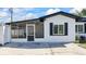 Home exterior featuring a screened-in porch and dark shutters at 3601 21St N St, St Petersburg, FL 33713