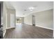 Bright living room with wood-look flooring, neutral walls, access to a deck, and ample natural light at 4423 Hill Dr, Valrico, FL 33596