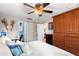 Bright bedroom with a large closet, ensuite bathroom, and comfortable bed at 5202 Beach Se Dr # C, St Petersburg, FL 33705
