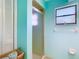 Bright bathroom featuring a glass-enclosed shower and ample storage at 5253 Sandra Dr, Weeki Wachee, FL 34607