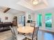 The dining area features a view to the living area and sliding doors to the lanai at 5253 Sandra Dr, Weeki Wachee, FL 34607