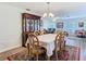 Bright dining room features a china cabinet, dining table, and view to the living area at 5253 Sandra Dr, Weeki Wachee, FL 34607