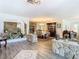 Spacious entryway showcasing stone accents, decorative shelves, and open-concept dining and living spaces at 5253 Sandra Dr, Weeki Wachee, FL 34607