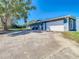 The exterior of the house features a garage and neutral color palette at 5253 Sandra Dr, Weeki Wachee, FL 34607