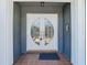 Elegant double front doors with decorative glass and tiled entryway, creating a grand entrance at 5253 Sandra Dr, Weeki Wachee, FL 34607