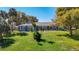 Beautiful one-story home with lush green lawn, mature trees, and inviting curb appeal at 5253 Sandra Dr, Weeki Wachee, FL 34607