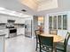 The bright kitchen features stainless appliances, granite counters and an eat in dining area at 5253 Sandra Dr, Weeki Wachee, FL 34607