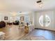 Bright and airy living room with hardwood floors, stone accents, and an inviting front door at 5253 Sandra Dr, Weeki Wachee, FL 34607