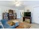 Bright living space with a comfortable sofa, built-in bookcase, and a TV for relaxing at 5253 Sandra Dr, Weeki Wachee, FL 34607