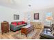 Comfortable living room features neutral tones, plush sofas, and natural light at 5253 Sandra Dr, Weeki Wachee, FL 34607
