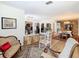 Open-concept living area with stone accents, hardwood floors, and classic furnishings at 5253 Sandra Dr, Weeki Wachee, FL 34607
