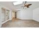 Bright living room with wood-look floors and sliding door to the lanai at 5303 12Th Avenue W Dr, Bradenton, FL 34209