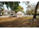 Spacious backyard featuring a white picket fence and seating area perfect for relaxation and outdoor enjoyment at 700 Lyndhurst St # 1024, Dunedin, FL 34698