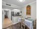 Charming dining area with a Florida-themed art piece and a table set for a pleasant meal at 700 Lyndhurst St # 1024, Dunedin, FL 34698