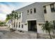 Exterior of a condo building with stairs, a covered entrance, and fresh landscaping at 700 Lyndhurst St # 1024, Dunedin, FL 34698