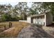 Charming detached garage with vintage-style door, providing secure parking and storage at 700 Lyndhurst St # 1024, Dunedin, FL 34698