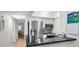 Modern kitchen featuring stainless steel appliances and black countertops, offering a sleek and functional space at 700 Lyndhurst St # 1024, Dunedin, FL 34698